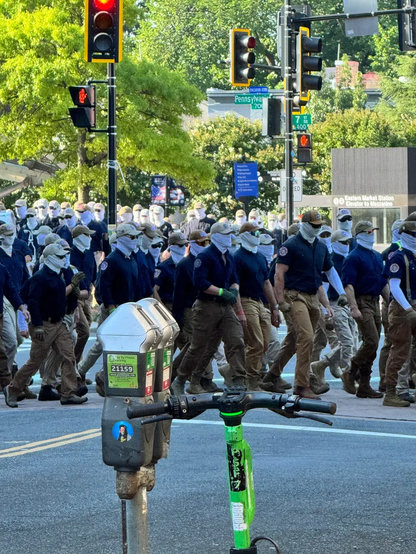 Dozens of Patriot Front Nazis walking the streets of DC headed to the Nazi State Fair