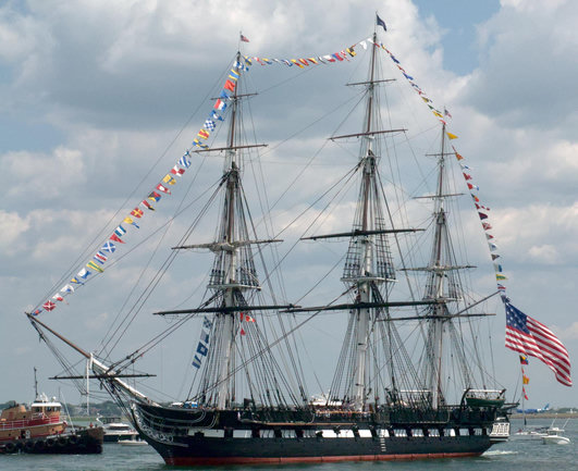 The USS Constitution heading back into Boston Harbor as part of its 4 July turnaround cruise