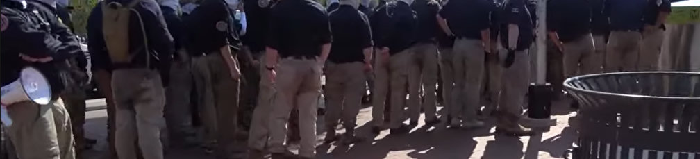 screenshot of Nazi fucks in Washington DC July 4 2026 standing in a group. the cropped shot is centered on their obviously wet pants at crotch level