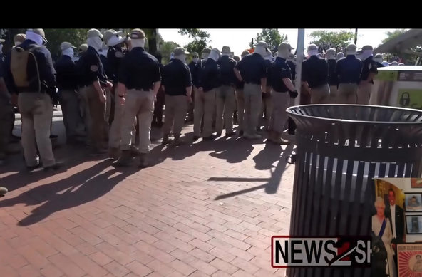 Boys standing around in soiled pants, proud