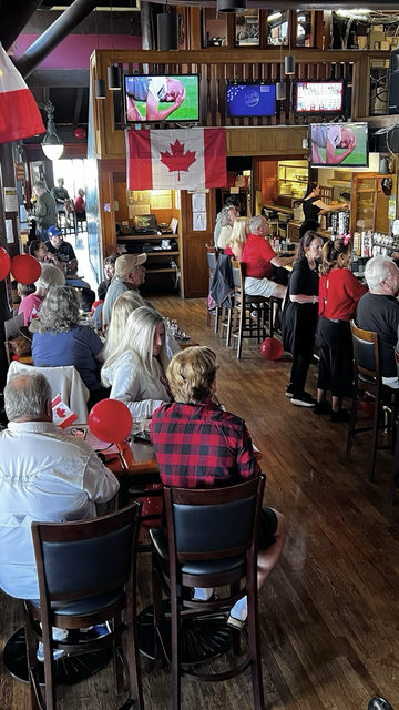 A pub full of people watching Canada play in the World Cup.