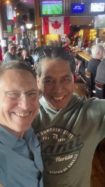 Avi Lewis taking a selfie with someone.
