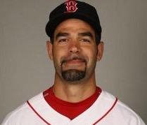 YOUR 2007 World Series MVP Mikey Lowell in his Red Sox official pic, in his V-neck white jersey and mustache twisted a little crooked with what we all hoped was a slly smile rather than a really bad job shaving.