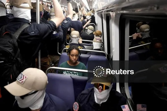 masked Nazis surrounding a lone black woman on a train in Washington DC 