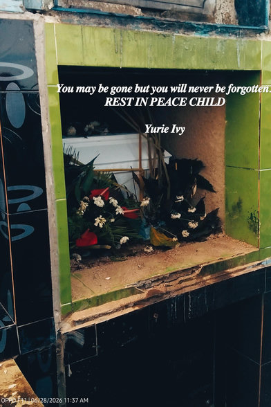 The memorial niche contains a white casket adorned with floral arrangements and a inscription for "Yurie Ivy".
The surrounding tiles are green, and the scene reflects a place of rest or remembrance.The text on the image expresses sentiments of lasting memory and peace