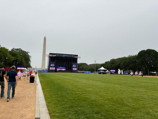 "The main stage sits largely empty on the National Mall during the Freedom 250 Great American State Fair. The event drew online criticism from people who pointed to thin crowds and limited attractions."