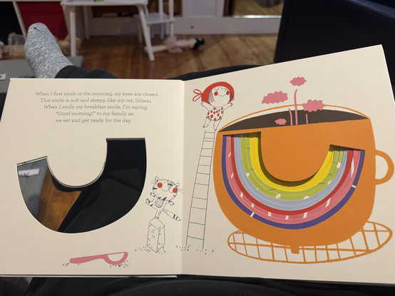 A children’s book, with an illustration resembling an upside-down rainbow
