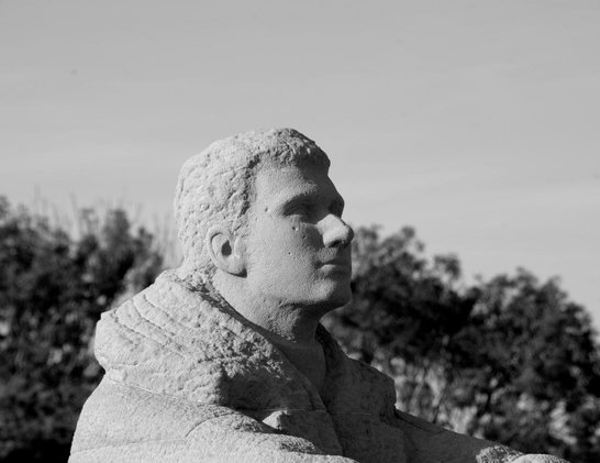 Battle of Britain Memorial

July 2024, Capel-le-Ferne/Kent

Black-and-white image of a stone statue depicting a person’s head and upper body, set outdoors with trees in the background.