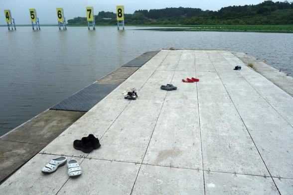 Seemingly abandoned shoes on a pontoon. People were boat training down the lake actually, but nowhere in sight at first