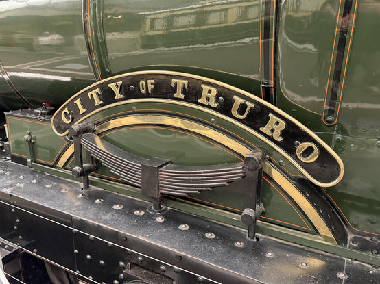 The curved name plate of City of Truro over the wheel splashers