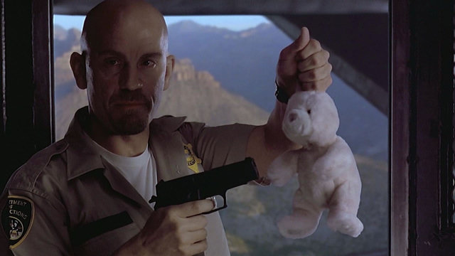 "Put the bunny down," drawls Nicolas Cage from off-screen while John Malkovich points a gun at a pink plush bunny rabbit.