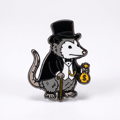 a metal enamel pin features a cartoon opossum dressed in a formal black tuxedo, top hat, and bowtie, holding a gold cane and a yellow money bag marked with a dollar sign.