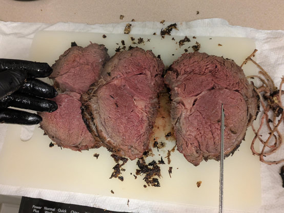 Some slices of a perfect medium rare smoke prime rib roast. Over charcoal and cherry wood. 