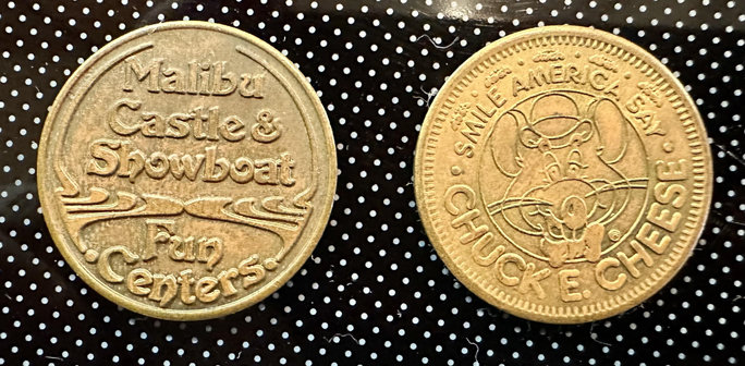 Old game tokens from Malibu Fun Centers and Chuck E. Cheese