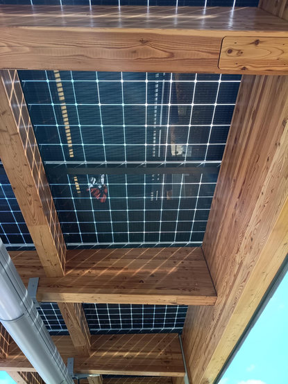 Underside of the roof of platform 1 at Cambridge South railway station, showing that the roof is made out of solar panels.