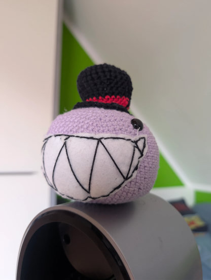 a Bubbles plushie wearing a tophat