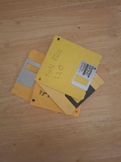 Pile of yellow 3.5 inch diskettes.