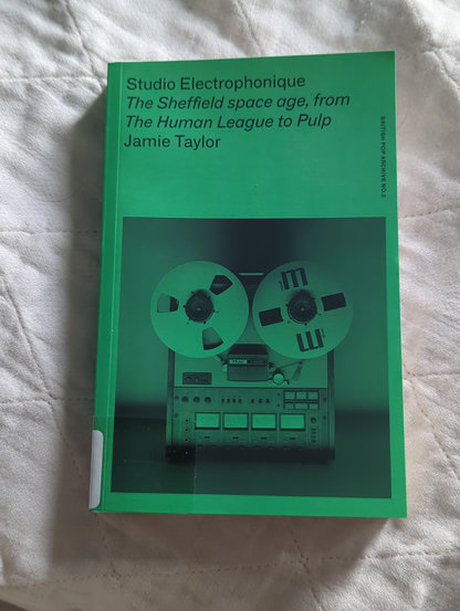 Green book with reel to reel tape recorder. Title Studio Electrophonique