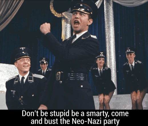 Scene from The Producers a Nazi singing with other Nazis in the background including women in short skirts and Nazi hats 
Text reads don't be stupid be a smarty come and bust the Neo-Nazi party