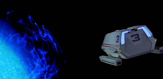 Shuttle craft with red stripe approaching planet