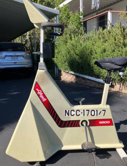Exercise bicycle with "NCC-1701/1" written on the side, via PhotoShop