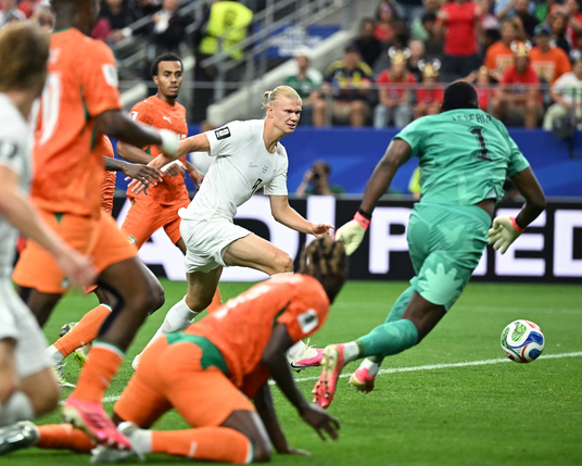 Erling Braut Haaland (C) shoots and scores. Photograph: Paul Ellis/AFP/Getty Images