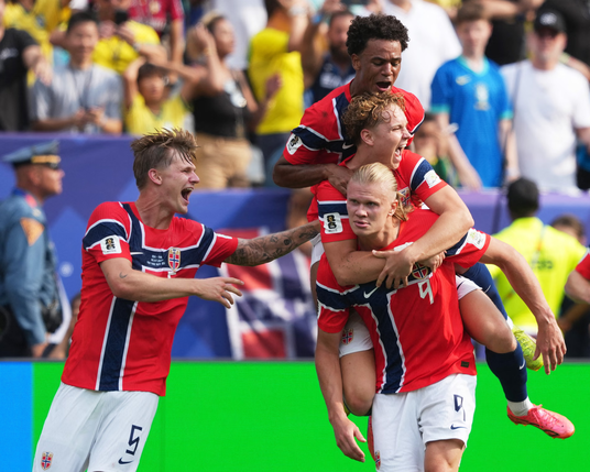 Norway's Erling Haaland celebrates scoring their first goal with teammates. Photograph: James Lang/IMAGN IMAGES/Reuters
