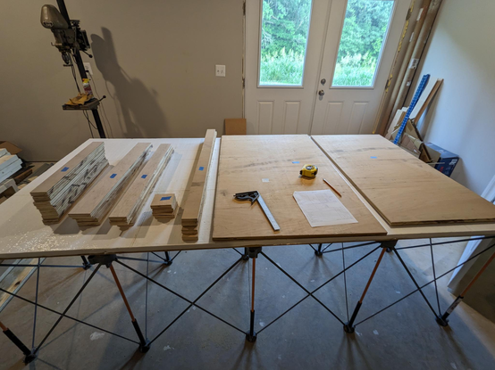 Piles of cut plywood in stacks, labeled A through G all IKEA like. Just have to assemble it into a table saw outfeed table.