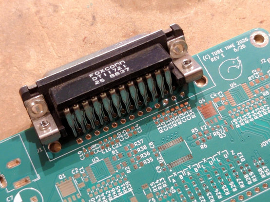 a Foxconn D sub connector, right angle, lined up against the footprint on a green circuit board. it's slightly too short.