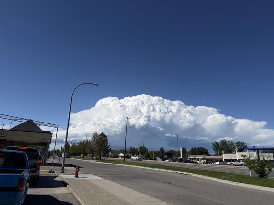 A huge thunderhead off to the north, against a deep blue sky. Taken while sitting at the DQ drive thru on Mayor Magrath Drive in Lethbridge 