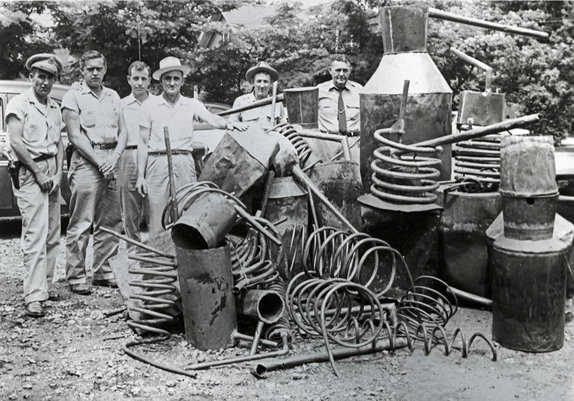 group of men busting moonshine stills in the 1940s