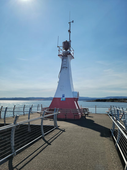 This is an image of the lighthouse beacon at the south end of the Ogden Point Breakwater. The Strait of Juaan de Fuca lies beyond.
