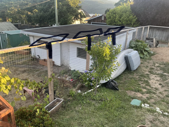 A picture of the side fence with my own drawing over top of the panels mounted on each post
